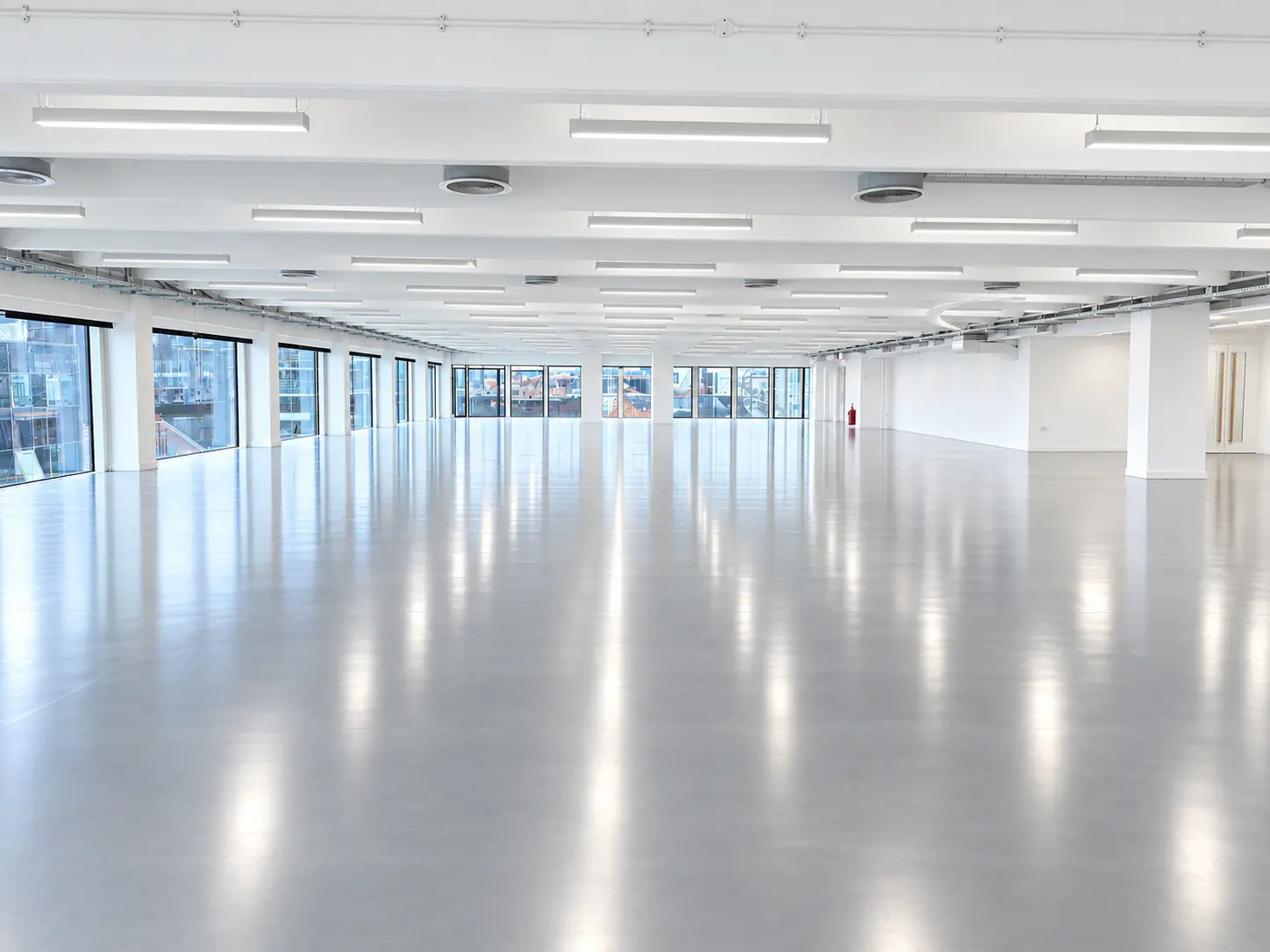 Open plan CAT A office refurbishment with new lighting and polished floor