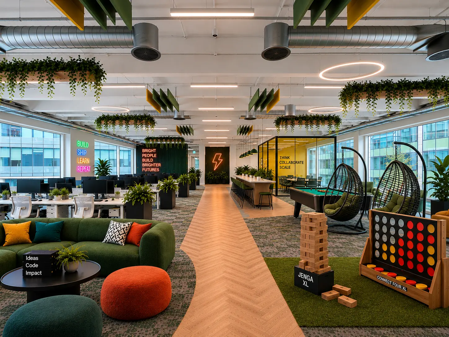 Modern office with workstations, collaborative areas, planting and breakout games