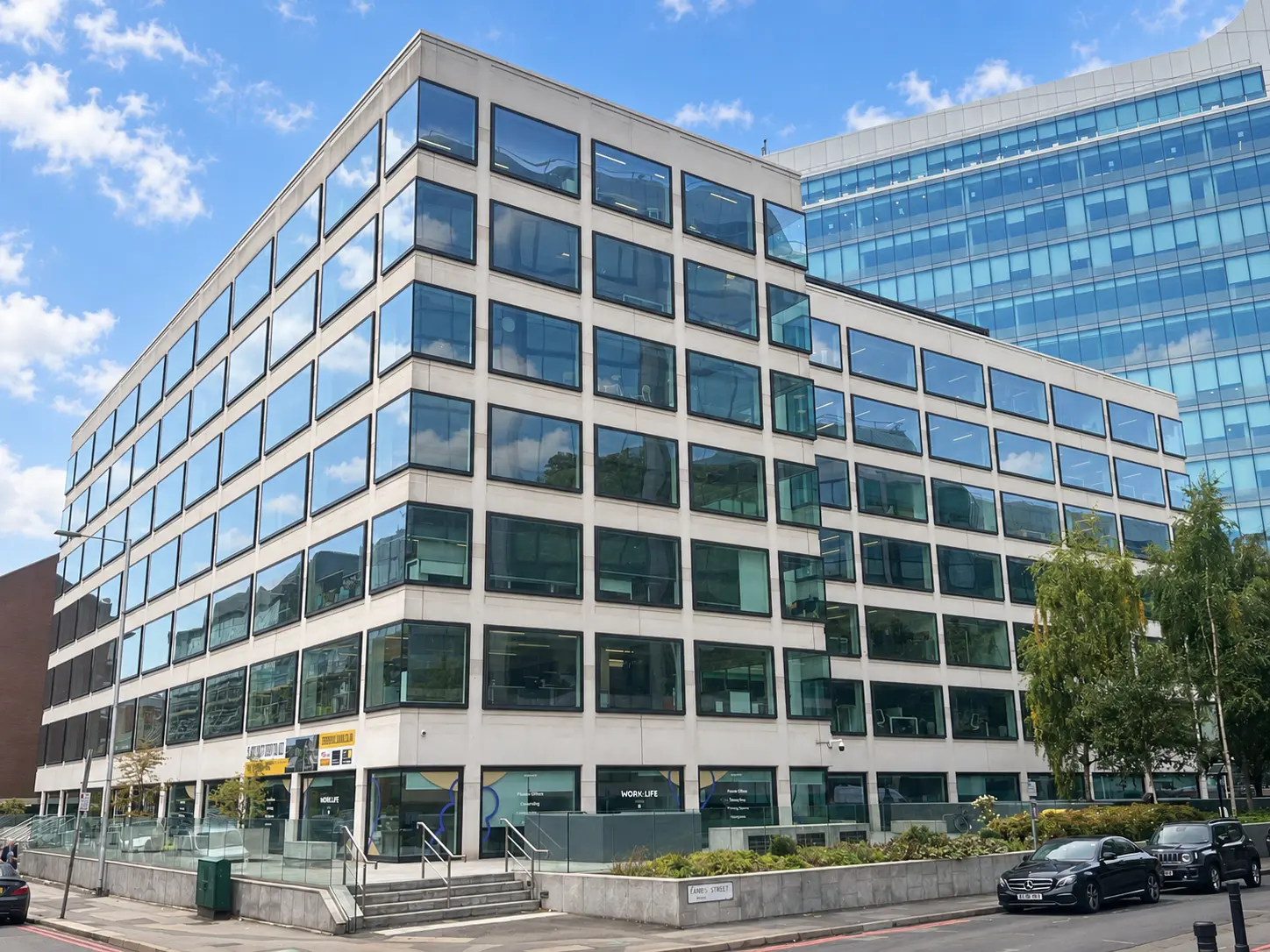 Large commercial office building managed by Leviter beneath a blue sky